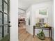 Bright foyer with hardwood floors and a view into the open kitchen and living area at 4068 Cottage Oaks Dr, Acworth, GA 30101