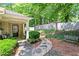 Welcoming front porch with seating and beautifully landscaped garden at 4068 Cottage Oaks Dr, Acworth, GA 30101