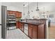 Well-lit kitchen with stainless steel appliances, granite counters, tile backsplash, and an eat-in bar at 4068 Cottage Oaks Dr, Acworth, GA 30101