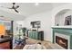 Inviting living room with fireplace, modern entertainment unit, and hardwood flooring at 4068 Cottage Oaks Dr, Acworth, GA 30101