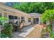 Cozy outdoor patio with a dining set, grill, and landscaped surroundings at 4068 Cottage Oaks Dr, Acworth, GA 30101