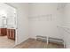 Spacious walk-in closet with ample shelving and wood-look flooring at 4068 Cottage Oaks Dr, Acworth, GA 30101