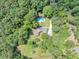 Overhead view of the property, pool area, and the lush surrounding landscape at 4820 Yeager Rd, Douglasville, GA 30135