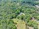 Aerial view of the property featuring a private pool surrounded by lush landscaping at 4820 Yeager Rd, Douglasville, GA 30135