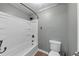 This bathroom has a tub and shower combo with a toilet at 4820 Yeager Rd, Douglasville, GA 30135