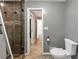 Cozy bathroom with tiled floors and a view into an adjacent room at 4820 Yeager Rd, Douglasville, GA 30135