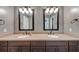 Bathroom featuring a dual sink vanity, dual mirrors and lighting, and neutral finishes at 4820 Yeager Rd, Douglasville, GA 30135