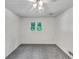 A bright bedroom with neutral carpet and white walls at 4820 Yeager Rd, Douglasville, GA 30135