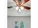 A close up of a ceiling fan in a room with a window at 4820 Yeager Rd, Douglasville, GA 30135