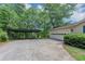 Long driveway leading to a well-maintained home with a covered parking area at 4820 Yeager Rd, Douglasville, GA 30135
