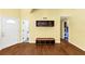 Entryway with hardwood floors, built in shelving, and view to a bathroom at 4820 Yeager Rd, Douglasville, GA 30135