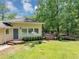 Charming home with welcoming blue door, complemented by a wooden deck at 4820 Yeager Rd, Douglasville, GA 30135