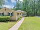 A well-maintained home with blue shutters and landscaping at 4820 Yeager Rd, Douglasville, GA 30135