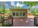 Charming home exterior with a wooden deck and well-maintained landscaping at 4820 Yeager Rd, Douglasville, GA 30135