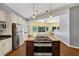 The open layout of the kitchen and island includes a stove top at 4820 Yeager Rd, Douglasville, GA 30135