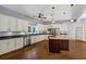 Spacious kitchen featuring an island with cooktop, stainless appliances, and abundant cabinetry at 4820 Yeager Rd, Douglasville, GA 30135