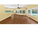 Spacious living room with hardwood floors and multiple windows offering natural light and backyard views at 4820 Yeager Rd, Douglasville, GA 30135