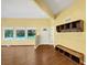 Bright living room featuring hardwood floors, large windows, and built-in shelving at 4820 Yeager Rd, Douglasville, GA 30135