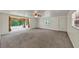 Spacious living room featuring a ceiling fan and a large picture window at 4820 Yeager Rd, Douglasville, GA 30135