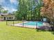 View of backyard pool with greenery and a covered structure at 4820 Yeager Rd, Douglasville, GA 30135