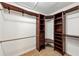 Well-organized walk-in closet with custom shelves and ample storage space at 4820 Yeager Rd, Douglasville, GA 30135