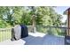 View of a back deck featuring outdoor seating and a grill, perfect for entertaining and relaxing at 118 Valleyside S Dr, Dallas, GA 30157