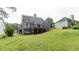Spacious backyard view showcases the deck and home exterior at 118 Valleyside S Dr, Dallas, GA 30157