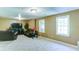 Spacious finished basement featuring soft carpet, bright windows, and a comfortable seating area at 118 Valleyside S Dr, Dallas, GA 30157