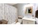 Neutral bathroom with shower-tub combo, vanity with mirror, and modern fixtures at 118 Valleyside S Dr, Dallas, GA 30157