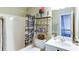 Shot of the bathroom shows a shower/tub combo, with shelves, a mirror, and sink at 118 Valleyside S Dr, Dallas, GA 30157