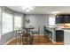 Bright breakfast nook with ample windows, cozy seating, and adjacent kitchen, perfect for casual meals at 118 Valleyside S Dr, Dallas, GA 30157