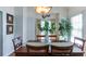 Cozy dining room features a wood table, natural light, and elegant decor, great for Gathering dinners at 118 Valleyside S Dr, Dallas, GA 30157