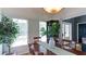 Bright dining area with hardwood floors, view of entryway, and lots of natural light at 118 Valleyside S Dr, Dallas, GA 30157