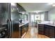 Functional kitchen with black appliances, white countertops, and breakfast area with bay windows at 118 Valleyside S Dr, Dallas, GA 30157