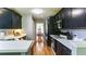Kitchen with black cabinets, white countertops, and modern appliances, providing a sleek design at 118 Valleyside S Dr, Dallas, GA 30157