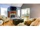 Cozy living room features a stone fireplace, vaulted ceiling, and hardwood floors at 118 Valleyside S Dr, Dallas, GA 30157