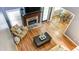 This upstairs view of the living room highlights the stone fireplace, hardwood, and breakfast nook at 118 Valleyside S Dr, Dallas, GA 30157