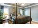 View of main bedroom shows a four-poster bed, hardwood floors, and decorator touches at 118 Valleyside S Dr, Dallas, GA 30157