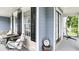 Charming porch area featuring comfortable seating and access to the backyard at 118 Valleyside S Dr, Dallas, GA 30157