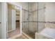 A well-lit glass shower and a view to the closet make this bathroom ideal at 2227 W Village Se Ln, Smyrna, GA 30080