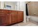 Bathroom with a wooden vanity, a toilet, and a shower curtain at 2227 W Village Se Ln, Smyrna, GA 30080