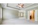 Primary bedroom with trey ceiling, ceiling fan, walk-in closet, and ensuite bathroom at 2227 W Village Se Ln, Smyrna, GA 30080