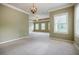 Large main bedroom with soft carpet and ample natural light from three windows at 2227 W Village Se Ln, Smyrna, GA 30080