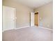A bright bedroom with neutral walls and carpet. Multiple entry ways for convenience at 2227 W Village Se Ln, Smyrna, GA 30080