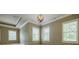 Spacious bedroom with trey ceiling and multiple windows for natural light at 2227 W Village Se Ln, Smyrna, GA 30080