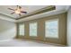 Spacious bedroom featuring trey ceiling and windows for natural light at 2227 W Village Se Ln, Smyrna, GA 30080