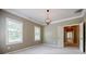 Neutral bedroom with ceiling fan, overhead lighting, and lots of natural light at 2227 W Village Se Ln, Smyrna, GA 30080