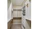 A well-organized walk-in closet with custom shelving, drawers, and ample space at 2227 W Village Se Ln, Smyrna, GA 30080