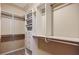 An organized walk-in closet with built-in shelves, drawers, and ample hanging space at 2227 W Village Se Ln, Smyrna, GA 30080