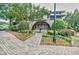 Well-maintained clubhouse surrounded by beautiful landscaping and a paved walkway, offering a welcoming entrance at 2227 W Village Se Ln, Smyrna, GA 30080